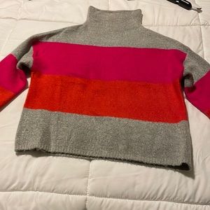 Cliche’ mock turtleneck with bold stripes